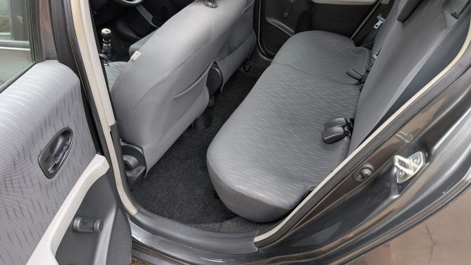 Rear seats and carpet of a Toyota Yaris in Wisbech, Cambridgeshire with visible staining on upholstery.