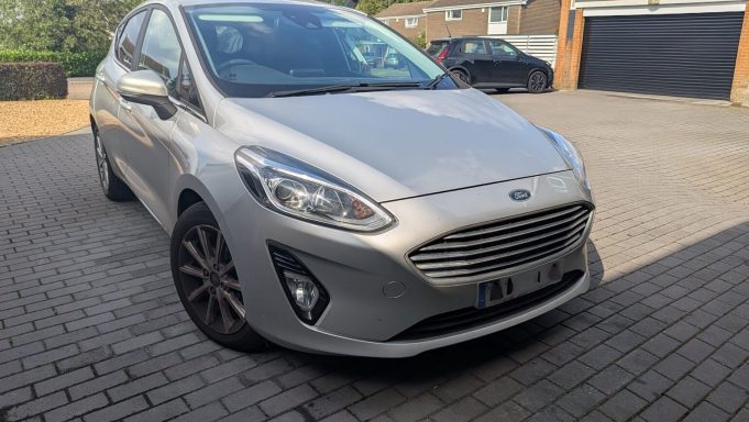 Front view of a silver Ford Fiesta in Barnack, Peterborough before detailing, showing brake dust on the wheels and grime on the paintwork