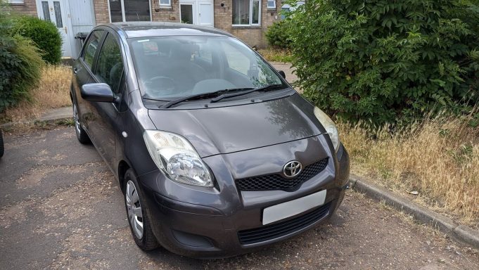 Dirty Toyota Yaris in Wisbech, Cambridgeshire before exterior car detailing, with dust visible on bonnet and bumper.