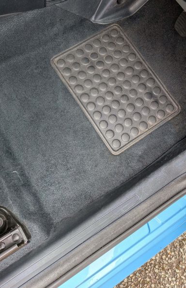 Ford KA driver’s footwell in  Yaxley, Peterborough after interior car detailing, with carpets refreshed and mats restored.