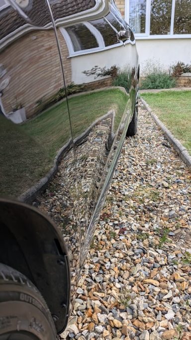 Renault Clio driver-side panel restored after tar removal and detailing in Newmarket, Suffolk.