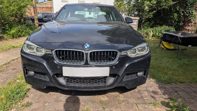 BMW 3 Series before exterior detailing in Stilton, Peterborough Dirty black BMW 3 Series in Stilton, Peterborough before exterior detailing, showing road film and dull paintwork.