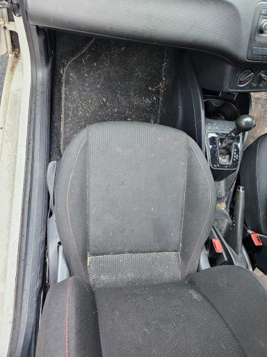SEAT Ibiza passenger footwell before carpet extraction, deep cleaning and pet hair removal