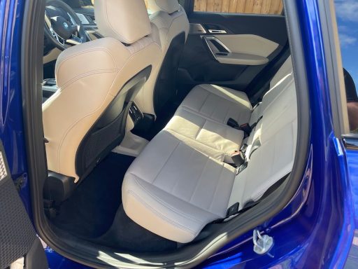 BMW iX1 rear seats in Godmanchester, Cambridgeshire after interior detailing, leather upholstery cleaned and carpets restored.