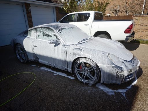 Porsche 911 Carrera Mobile Detail - Cambridgeshire Silver Porsche 911 Carrera receiving a snow foam pre-wash during a mobile car detailing service in Cambridgeshire