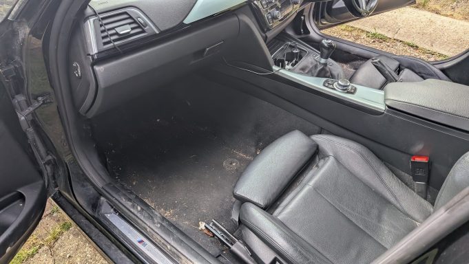 BMW Passenger Footwell Before Detail - Stilton Peterborough BMW passenger footwell before interior detailing in Stilton, Peterborough.