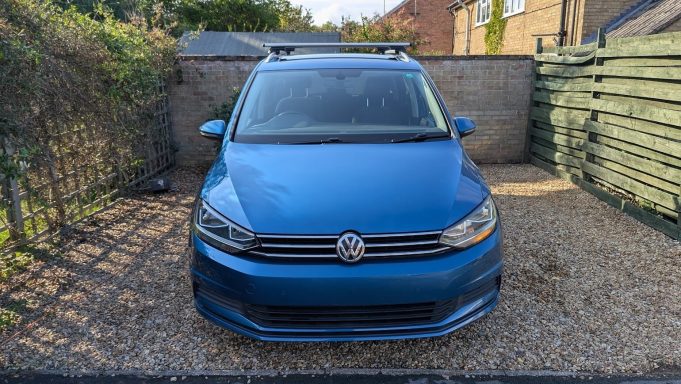 VW Touran in St Ives, Cambridgeshire after snow foam pre-wash and exterior detailing, with bodywork restored and glass cleaned.