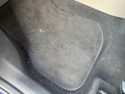 BMW iX1 passenger footwell before interior detailing & valeting in Wittering, Peterborough