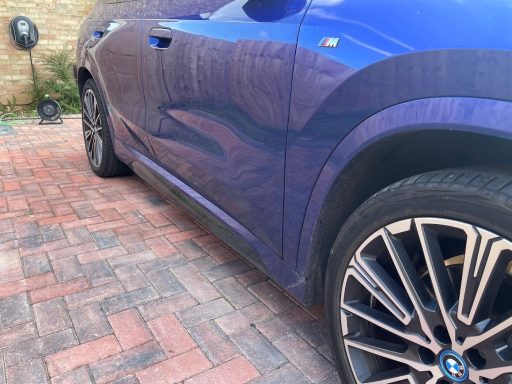 BMW X1 Lower Panel Build-Up Road grime along the lower panels of a BMW X1 before detailing.
