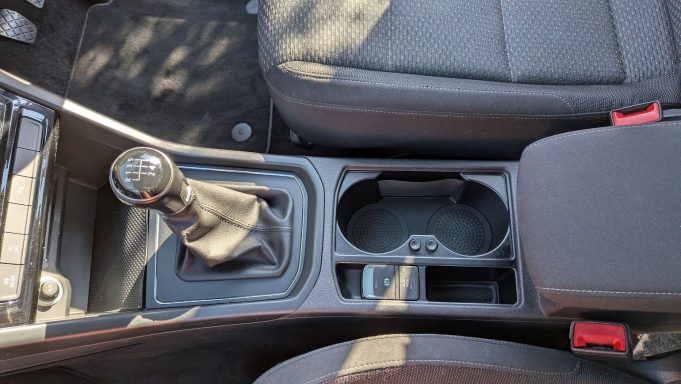 Clean VW Touran centre console in St Ives, Cambridgeshire after interior detailing, with cup holders and storage compartments fully cleaned.