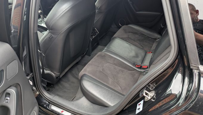 Rear seats of Audi S4 in Huntingdon after interior detailing, clean fabric and leather with carpets refreshed.
