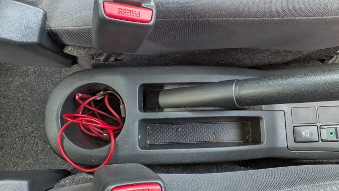 Dirty centre console of a Toyota Yaris in Wisbech, Cambridgeshire before interior detailing.